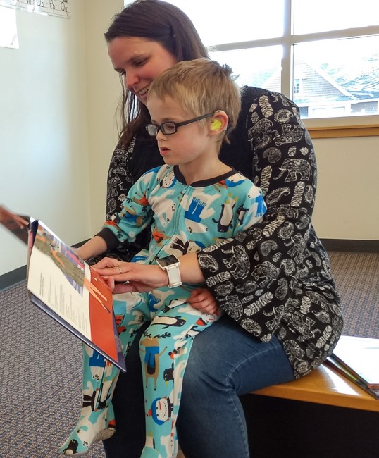 Jonathon and his mom read a book.