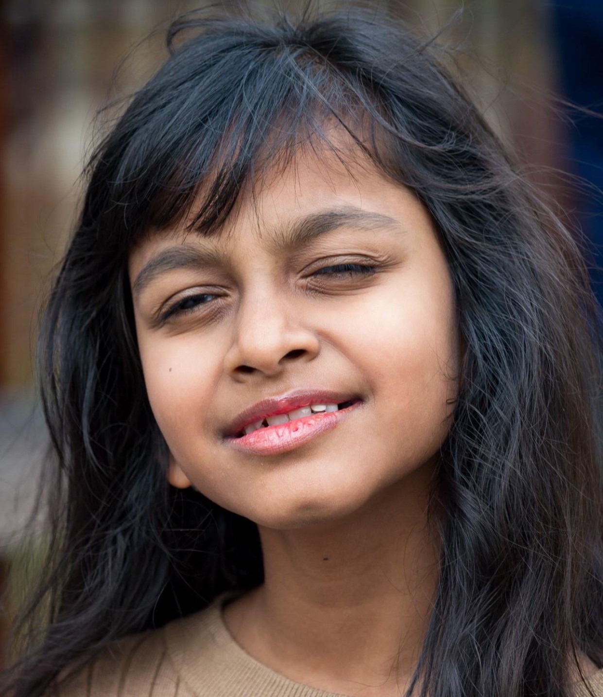 Head shot of a 10-year old girl with Usher syndrome.